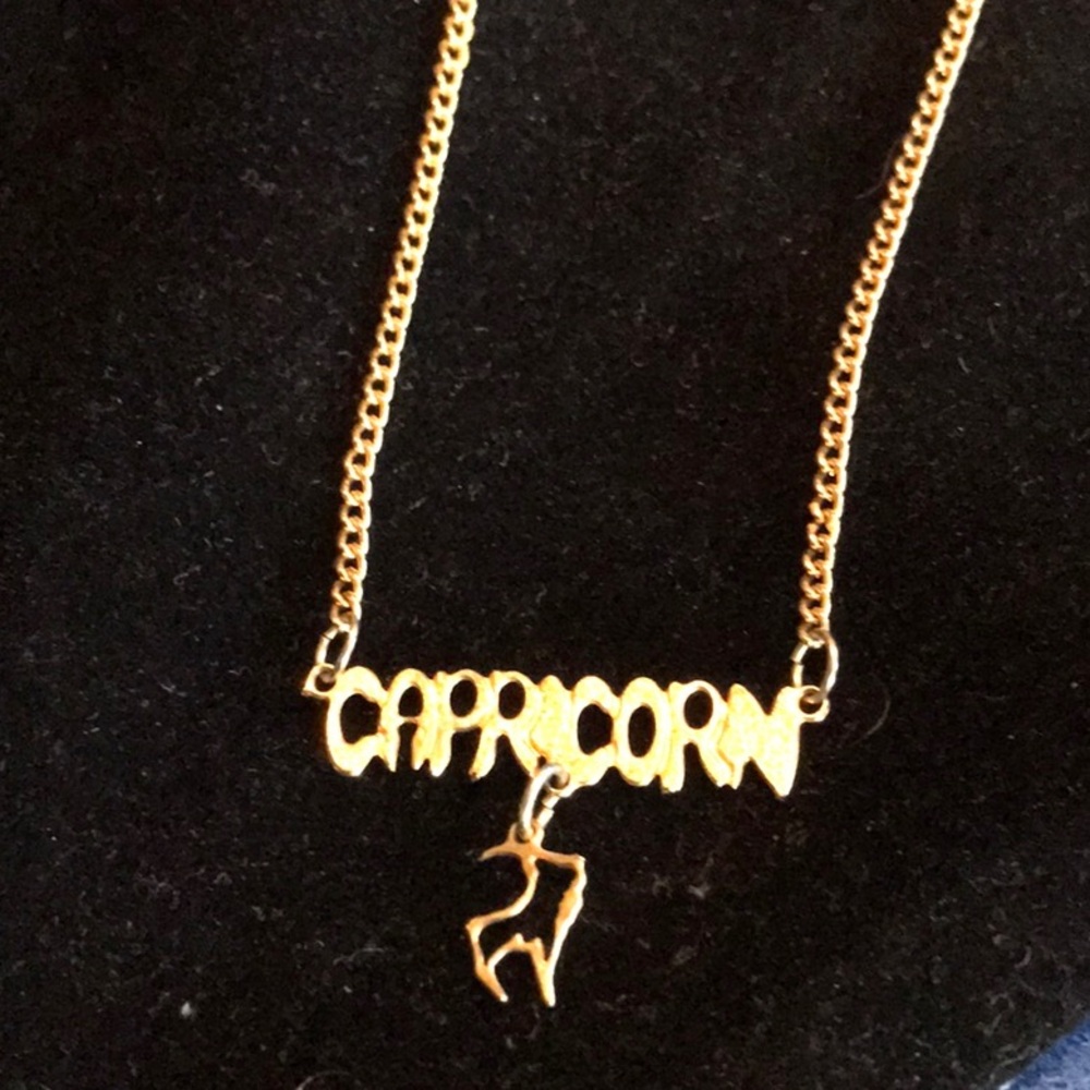 Gold tone Capricorn Necklace 16 inch.